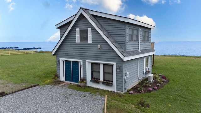 1150 Brammer Dr, Heathsville, VA 22473 - view of front of home featuring a water view, roof with shingles, and a front lawn