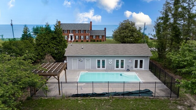1150 Brammer Dr, Heathsville, VA 22473 - rear view of house with fence, french doors, a patio area, and a water view