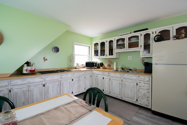 1150 Brammer Dr, Heathsville, VA 22473 - kitchen with stainless steel appliances, a sink, dark wood-style floors, glass insert cabinets, and white cabinets