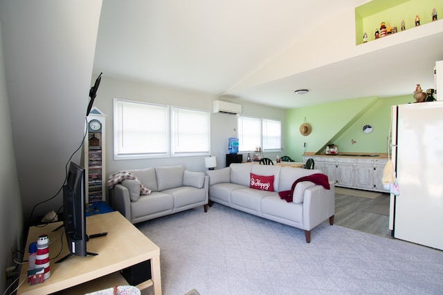 1150 Brammer Dr, Heathsville, VA 22473 - living room featuring a wall mounted air conditioner, lofted ceiling, and light colored carpet