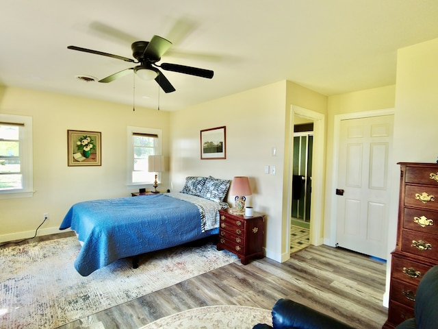 bedroom featuring light hardwood / wood-style flooring and ceiling fan