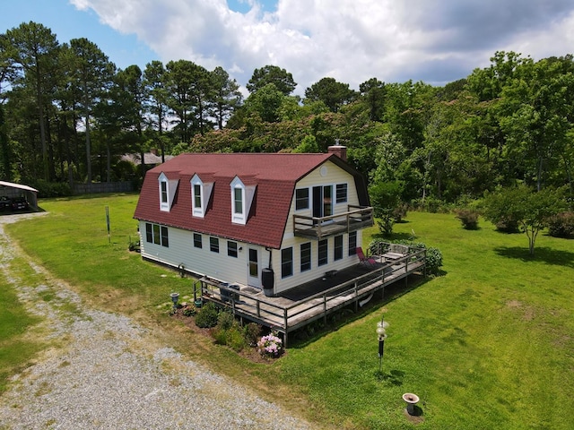 exterior space with a lawn and a wooden deck