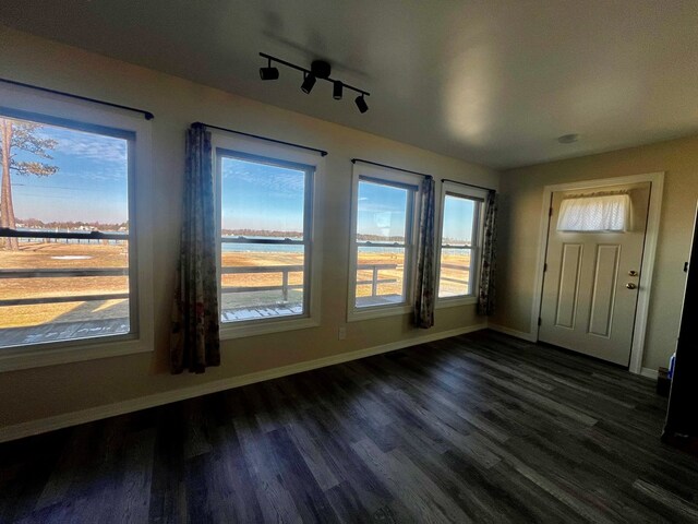 home office featuring ceiling fan and dark hardwood / wood-style flooring