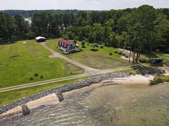 bird's eye view with a wooded view and a rural view