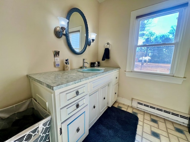 bathroom featuring a baseboard radiator, vanity, and baseboards