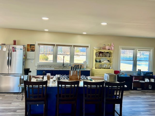 dining room featuring recessed lighting and light wood-style flooring