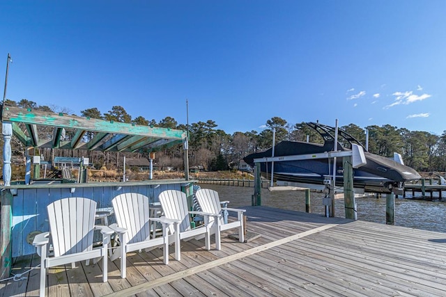 view of dock with a water view and boat lift