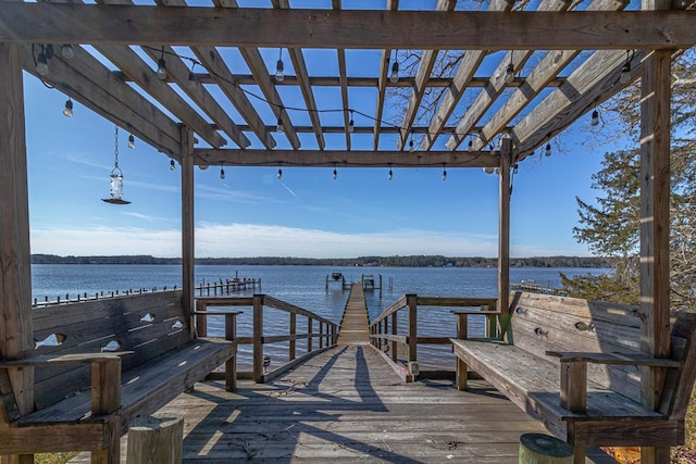 view of dock featuring a water view and a pergola