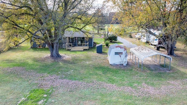 view of yard featuring a porch and a shed