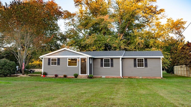 single story home featuring a front lawn