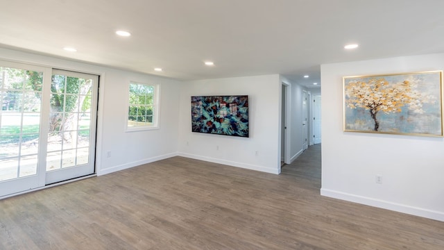 spare room with dark hardwood / wood-style floors