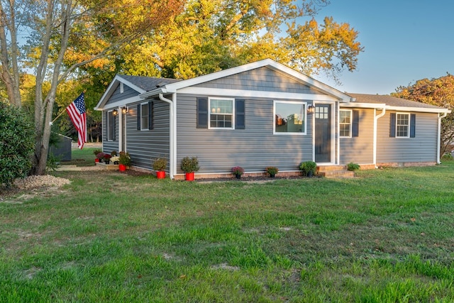 rear view of house with a yard