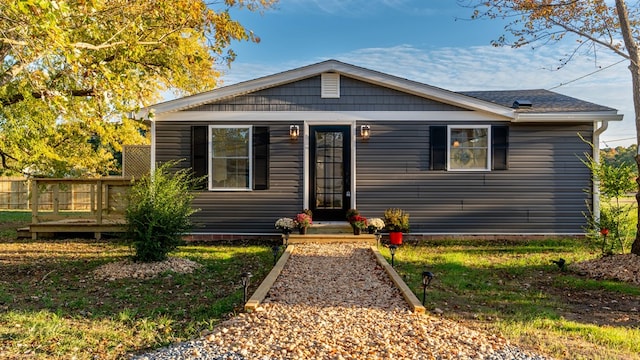 bungalow with a wooden deck