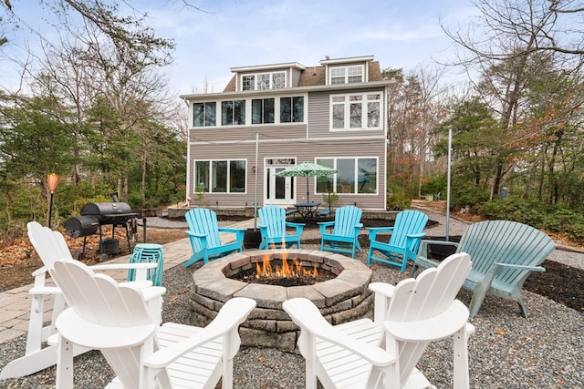 view of patio / terrace featuring an outdoor fire pit