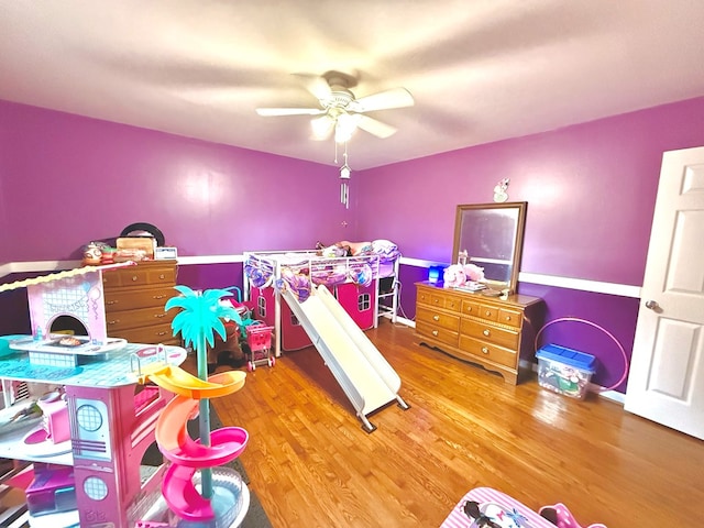 bedroom with hardwood / wood-style floors and ceiling fan