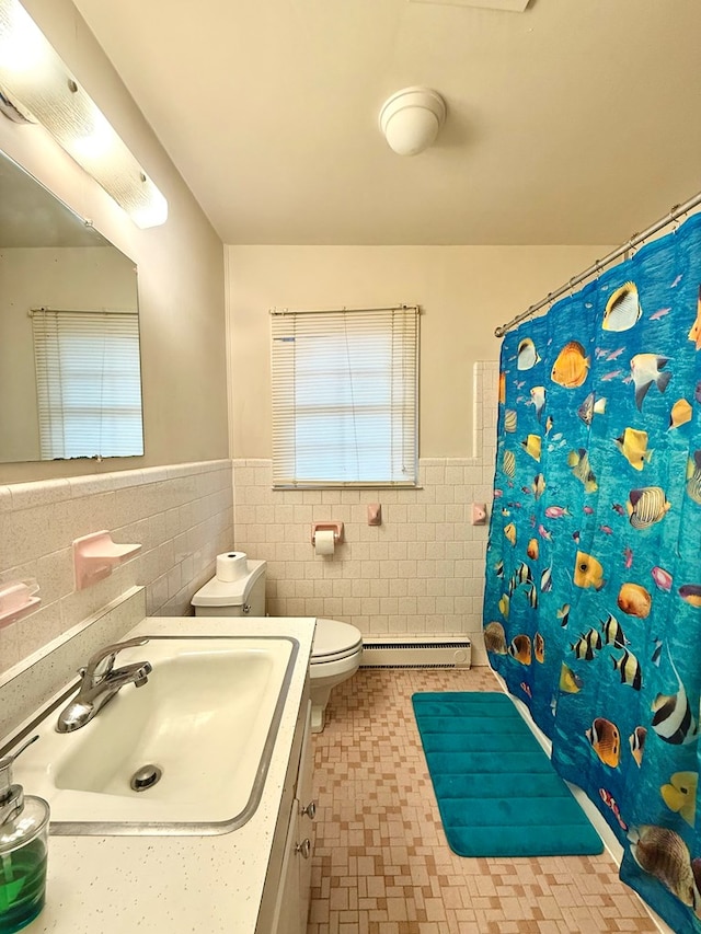 bathroom with toilet, sink, tile walls, curtained shower, and a baseboard heating unit