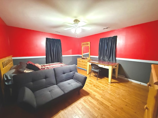 bedroom with hardwood / wood-style flooring and ceiling fan