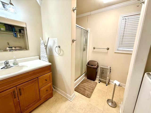 bathroom featuring walk in shower, tile patterned floors, ornamental molding, radiator heating unit, and vanity