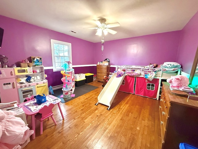 bedroom with hardwood / wood-style flooring and ceiling fan