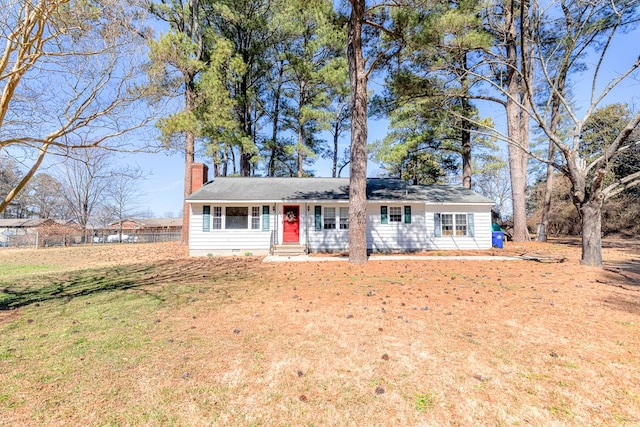 single story home featuring crawl space, entry steps, a chimney, and a front lawn