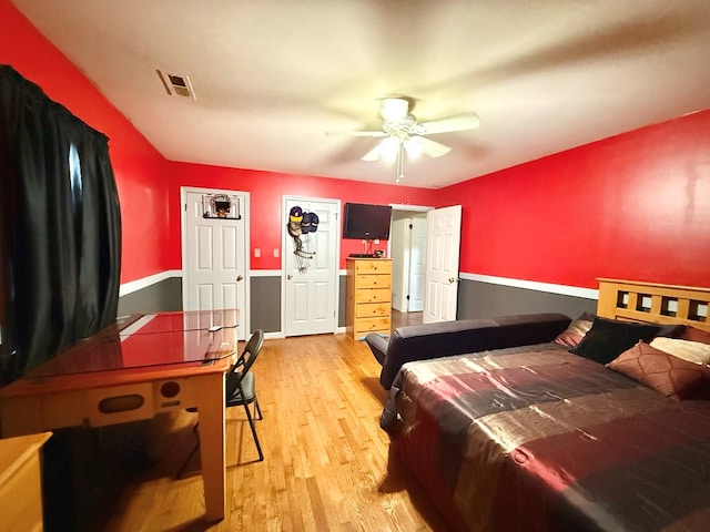 bedroom with ceiling fan and light hardwood / wood-style flooring