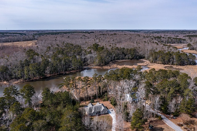 aerial view featuring a water view and a wooded view