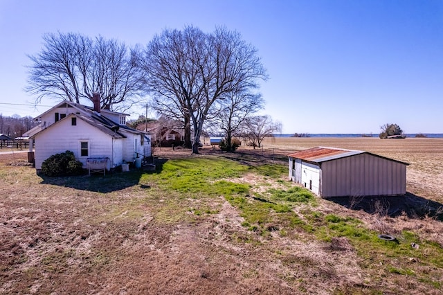 view of yard with a rural view