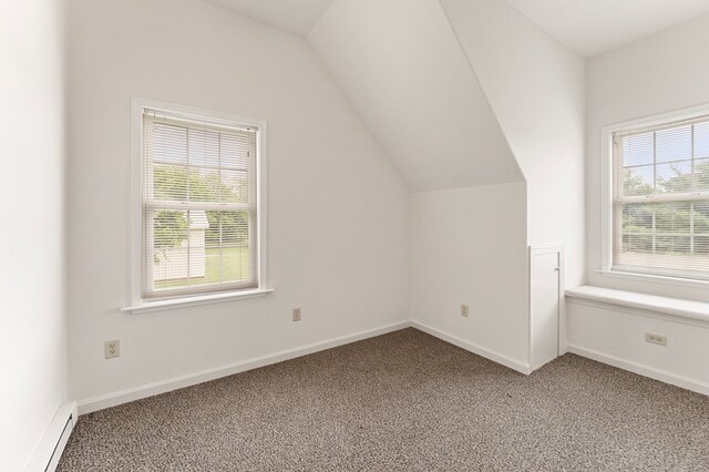 367 Edgewater Ln, Montross, VA 22520 - bonus room with a baseboard heating unit, light colored carpet, vaulted ceiling, and baseboards