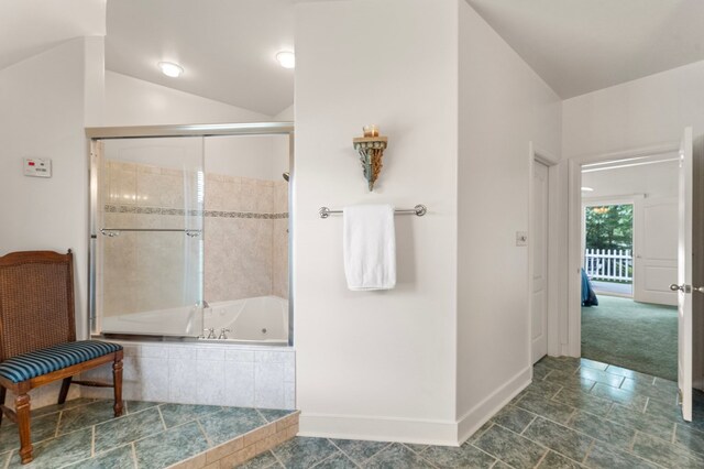 367 Edgewater Ln, Montross, VA 22520 - full bath featuring baseboards, vaulted ceiling, and tiled shower / bath