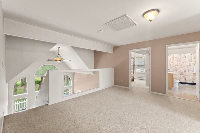 367 Edgewater Ln, Montross, VA 22520 - unfurnished living room with carpet, a ceiling fan, baseboards, and baseboard heating