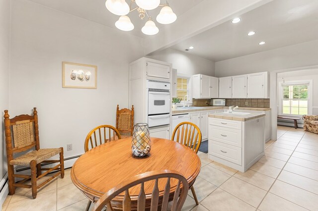 367 Edgewater Ln, Montross, VA 22520 - dining room featuring light tile patterned flooring, a chandelier, recessed lighting, and a baseboard heating unit