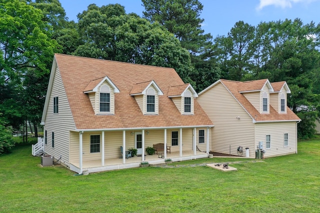 367 Edgewater Ln, Montross, VA 22520 - view of front facade with a front lawn, covered porch, cooling unit, and roof with shingles