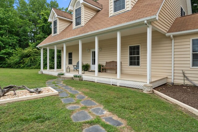 367 Edgewater Ln, Montross, VA 22520 - doorway to property featuring a porch, a yard, and a shingled roof