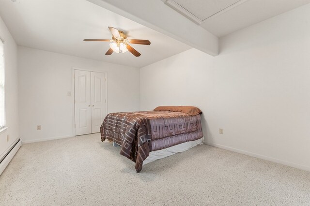 367 Edgewater Ln, Montross, VA 22520 - carpeted bedroom with a baseboard radiator, baseboards, a ceiling fan, and a closet