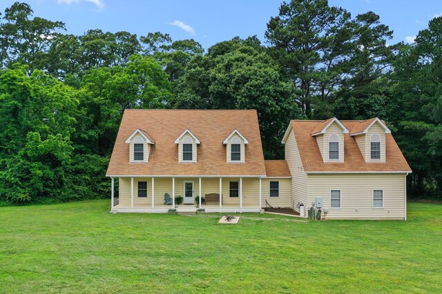 367 Edgewater Ln, Montross, VA 22520 - cape cod home with a front lawn and a porch