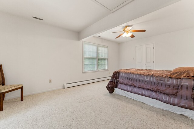 367 Edgewater Ln, Montross, VA 22520 - carpeted bedroom featuring a baseboard radiator, baseboards, a ceiling fan, and a closet