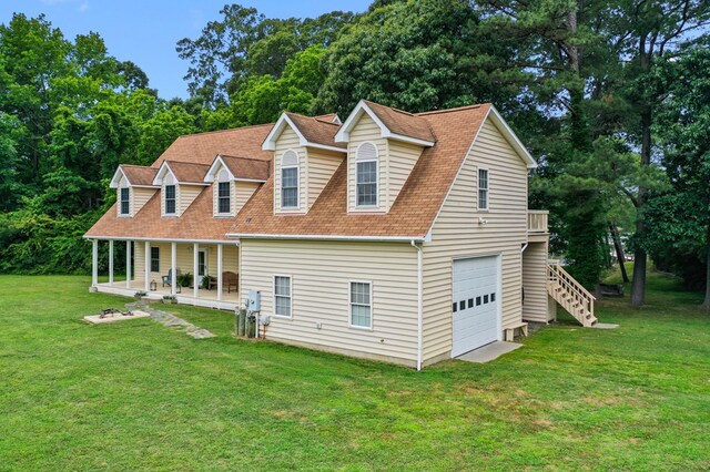 367 Edgewater Ln, Montross, VA 22520 - view of front of property with a front lawn, stairway, covered porch, a garage, and a shingled roof