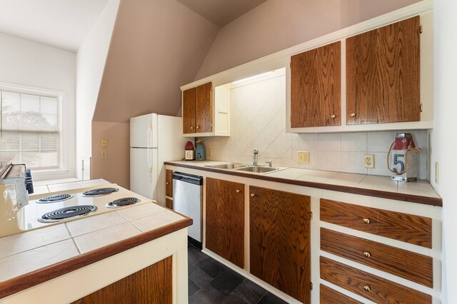 367 Edgewater Ln, Montross, VA 22520 - kitchen featuring tile counters, white appliances, decorative backsplash, a sink, and lofted ceiling