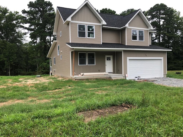 view of front of house featuring a front yard and a garage