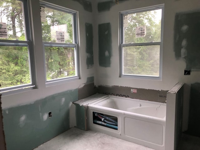 bathroom featuring a tub