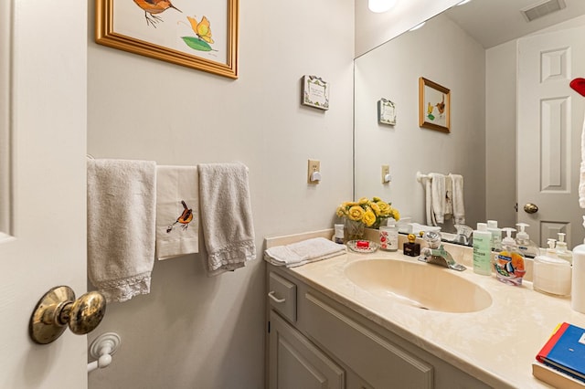 bathroom with visible vents and vanity