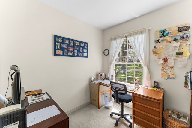 home office featuring carpet flooring and baseboards