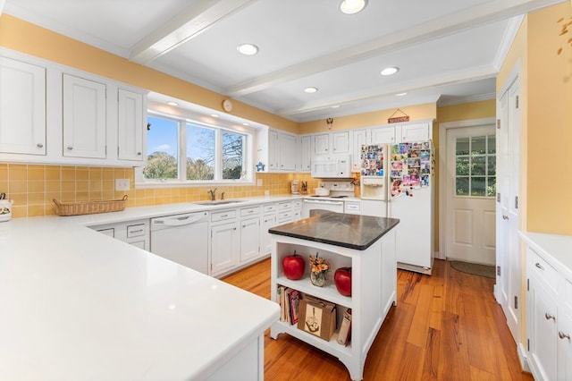 kitchen with white cabinets, open shelves, a sink, white appliances, and beamed ceiling