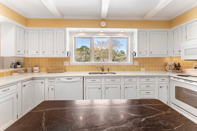 kitchen with white appliances, white cabinets, a sink, and beam ceiling