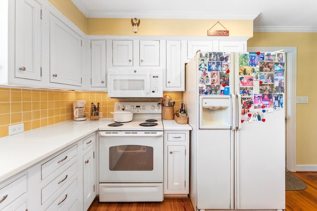 kitchen featuring ornamental molding, white cabinetry, backsplash, and white appliances