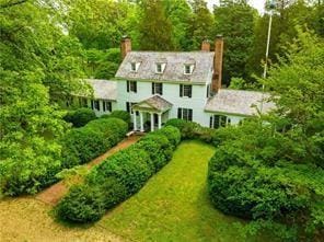 colonial home with a front yard