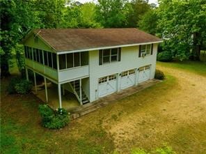 567 Seaford Ln, Mathews, VA 23109 - back of house with a sunroom and a yard
