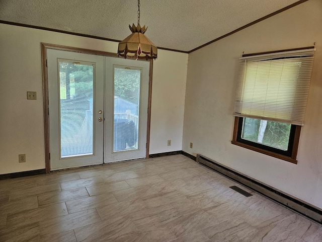 interior space featuring plenty of natural light, french doors, a textured ceiling, and a baseboard heating unit