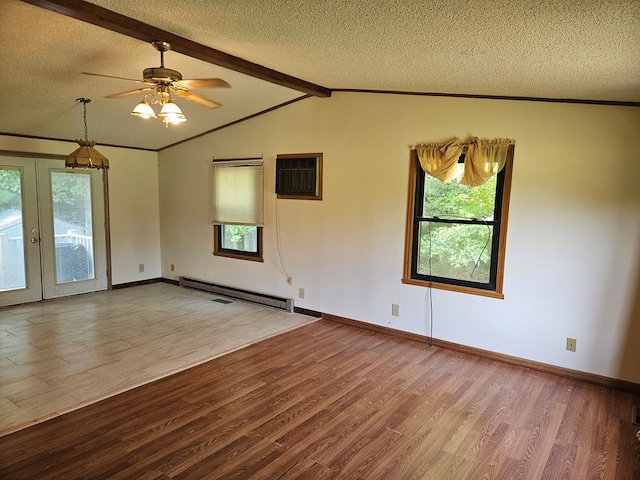 empty room with a textured ceiling, wood-type flooring, french doors, and a baseboard radiator