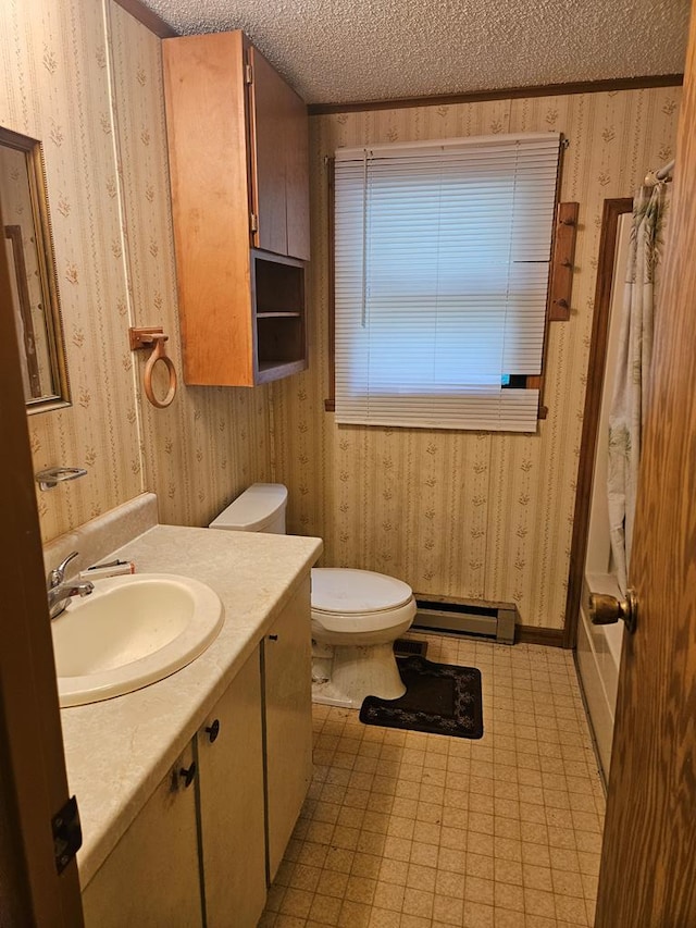 bathroom featuring vanity, toilet, a textured ceiling, and a baseboard heating unit